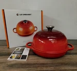 Creuset Enameled Cast Iron 1.75 Quart Bread Oven, Cerise Red - New. Fixed Price $279.95.