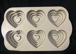 Nordic Ware Tiered Heart Cakelet Pan Gold Colored 3 Cups. Fixed Price $22.48.