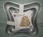 Wilton Perfect Performance Pillow Cake Pan Set, 2105-0575 New Fast Shipping. Fixed Price $14.49.