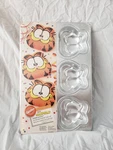 New Sealed Vintage 1992 Wilton Garfield Cat Mini Cake Pan 6 Smiling Face Molds. Fixed Price $34.99.