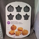 Wilton Whoopie Pan Autumn Fall Pumpkin Leaf Shape 12 Cavity Nonstick New. Fixed Price $14.00.