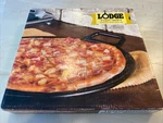 Lodge Pre-seasoned Cast Iron Baking Pan With Loop Handles, 14", Black Nib. Fixed Price $50.00.