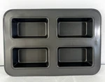 Wilton Indulgence Four (4) Cavity Mini Loaf Pan Heavy Duty Steel Non-stick 15.5". Fixed Price $33.99.