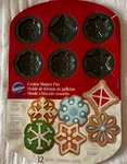 Wilton Cookie Shapes Pan (2105-0567) With Designs 12 Cavities Christmas Winter. Fixed Price $21.99.