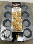 Wilton Recipe Right Non-stick 12 Cup Muffin Baking Pan With Tall Lid. Fixed Price $29.99.