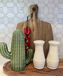 Le Creuset White Stoneware Salt And Pepper Shakers.. Fixed Price $22.00.