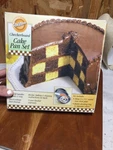 Wilton Checkerboard 2005 Cake Bakeware Set Includes Three 9" Round Pans. Fixed Price $14.99.