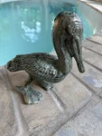 Cast Iron Pelican Weathered Green Patina. Fixed Price $22.00.