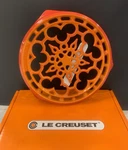 Creuset Enameled Cast Iron Deluxe Round Trivet, Flame. Fixed Price $169.00.