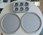 Set Of Baker Secret Non-stick Pizza Pans 12" Cookie Sheets & One Muffin. Fixed Price $12.95.