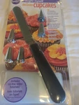 Wilton "i Taught Myself Decorate Cupcakes" Decorating Book W/spreader. Fixed Price $12.00.