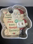 Vintage 1995 Wilton Santa Checking List Aluminum Cake Mold Pan 2105-3323. Fixed Price $14.95.