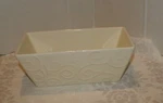 Real Home Earthenware Let Us Entertain You Embossed Floral Baking Loaf Pan. Fixed Price $15.00.