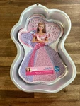 New Wilton Enchanted Barbie Cake Pan With Face Plate, Stock Number 2105-8910. Fixed Price $17.81.