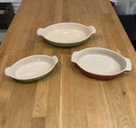 Of Three Le Cruset French Stoneware Ovular Dishes. Fixed Price $150.00.