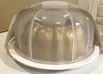 Nordic Ware 12-CUP Bundt Pan And Twist To Lock Translucent Cake Keeper. Fixed Price $25.00.