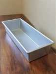 Amco Bakeware Commercial Heavy Duty Folded Metal 13X5 Inch Bread Pan 900495. Fixed Price $21.68.