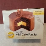 New 4 Pc Wilton Tasty-fill Mini Cake Pan Set & Recipe Booklet 2105-155. Fixed Price $14.95.