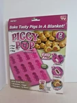 New Piggy Pop Silicone Baking Pan Bakes 12 Pigs As Seen Tv. Fixed Price $9.98.