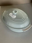 Creuset Stoneware Classic Covered Oval Casserole In Pistache 1.8QT Second. Fixed Price $69.00.