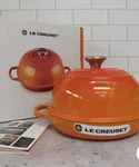 Creuset Enameled Cast Iron Signature Round Bread Oven, 9.5 Inch, Flame. Fixed Price $180.00.