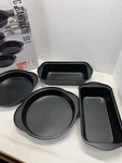 Hell's Kitchen Bakeware Set 4 Pc 2 Round Cake Pans And Loaf. Fixed Price $22.00.