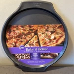 New 12-INCH Wilton Bake It Better Pizza Pan Heavy Duty Steel Non-stick Surface. Fixed Price $15.99.