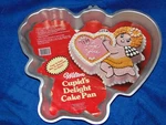 New Vintage Wilton Cupid's Delight Cake Pan Stock Number 502-4262. Fixed Price $19.99.