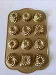 Nordic Ware Charms Cast Bundt Pan, 1.2 Cup Capacity, Gold. Fixed Price $34.99.