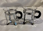 Set 2 Bodum Clear Glass Tea/coffee/ Bistro Mugs Stainless Holder Blk Handle. Fixed Price $18.99.