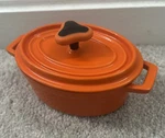 Rachael Ray Orange Enamel Cast Iron Mini Oval Casserole Dish. Fixed Price $24.99.