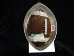 New Wilton First & Ten Football Cake Pan, Stock Number 2105-6504. Fixed Price $19.99.