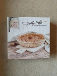 Dolly Parton 9.25" Round Glass Pie Plate & Wicker Basket Set. Fixed Price $21.00.