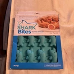 New-mobi 12 Shark Bites Oven-safe 9.5" X 8" Silicone Kitchen Baking Mold. Fixed Price $12.99.