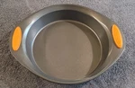 Rachel Ray Nonstick Round Cake Pan Orange Silicone Handles. Fixed Price $10.00.