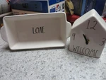 Rae Dunn Artisan Collection: Welcome Shelf Clock & Loaf Bread Baking Pan. Fixed Price $24.99.