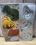 Wilton 1993 Mini Dinosaurs Cake Pan Mold Stock #2105-9331 Sealed But Torn. Fixed Price $15.95.