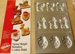 New Wilton Santa/reindeer/sleigh Cookie Treat Pan, 9 Cavity, 2306-111. Fixed Price $15.99.