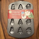Wilton 12 Cavity Christmas Tree Snowman Santa Claus Holiday Non-stick Cookie Pan. Fixed Price $8.99.