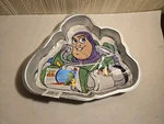 New Disney Pixar Toy Story Buzz Lightyear Cake Pan Mold Wilton 2105-8080. Fixed Price $15.00.